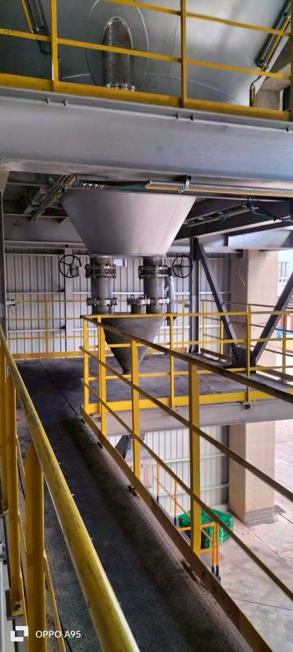 Installed plant piping, hopper and valves with access platforms